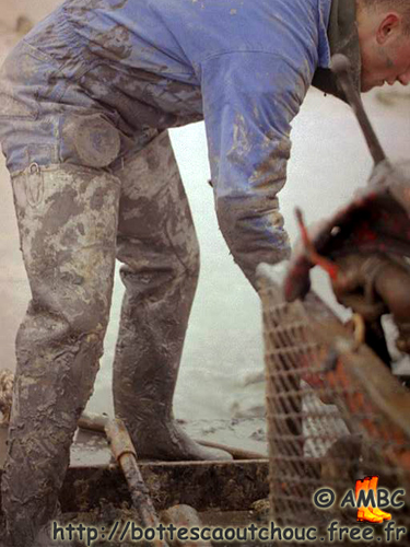Wearing muddy waders.