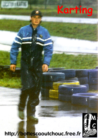 Young guy wearing rubber boots for karting.