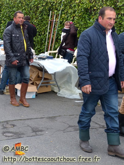 Wearing openly rubber boots  in Chailly en Bière boot sales, France. Gummistiefel, botas de gomma, rubber laarzen, stivali di gomma, wellies, bottes caoutchouc, May 2013.