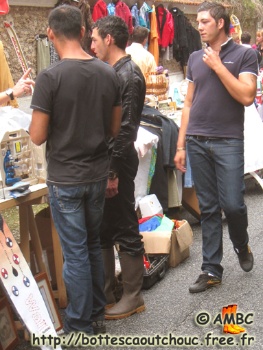 Nice looking rubberbooted guy among his mates, 2010.