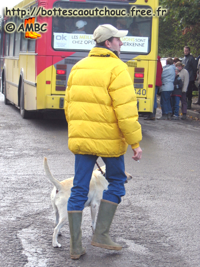 Wearing rubber boots with his dog;  Soumagne, Belgium, Oct. 2003. Gummistiefel, rubber laarzen, stivali di gomma, bottes caoutchouc.