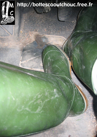 Driving in green wellies.