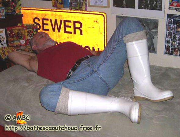 JIM IN WHITE WELLIES IN HIS BEDROOM.