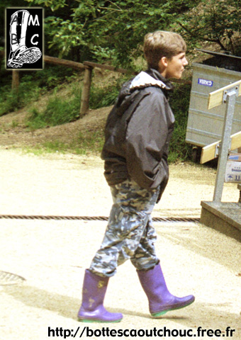Boy in wellies in Vallorbe, Switzerland. 