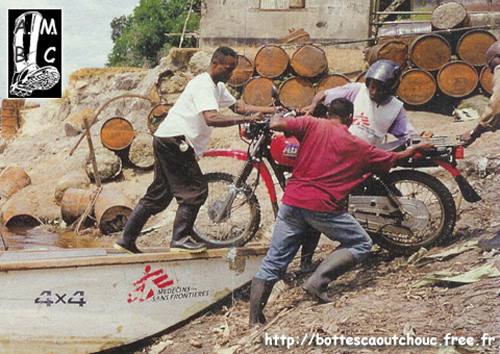 Young African people and motorbike, 2005. 