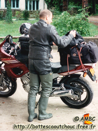 Biker from Lyon, wearing green waders, France, May 1996. Gummistiefel, rubber boots, bottes caoutchouc.