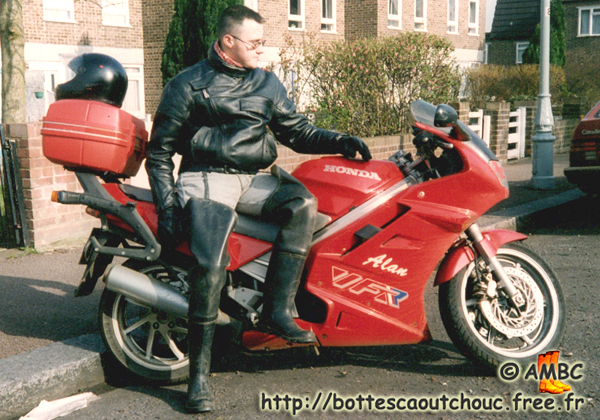 Pascal wearing waders,on Alan's motorbike, February 1995. Gummistiefel, rubber boots, bottes caoutchouc.