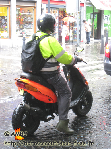 Young biker in gumboots, in Liège, Belgium, 23 July 2010. Gummistiefel, rubber boots, bottes caoutchouc.