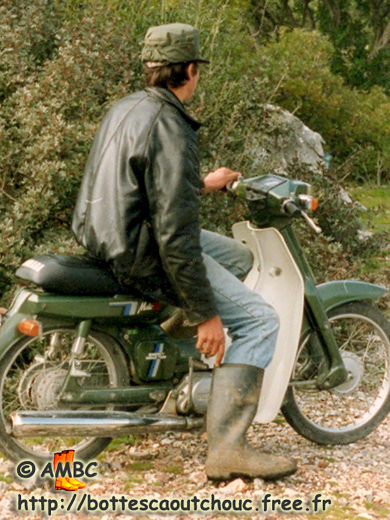 Young Greek shepherd wearing rubber boots; Greece, Friday 08 March 1996. Gummistiefel, rubber boots, bottes caoutchouc.