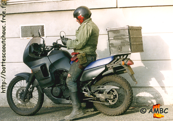 A friend, biker, wearing rubber boots and rubber gloves on his bike, France, January 1996. Gummistiefel, rubber boots, bottes caoutchouc.