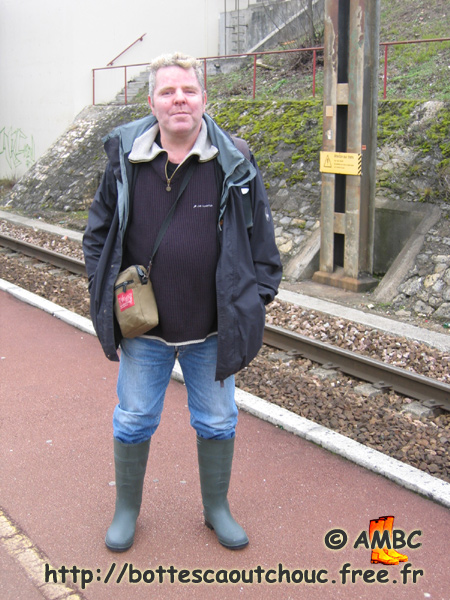Philippe on the platform, 2006. Gummistiefel, bottes caoutchouc, rubber boots.
