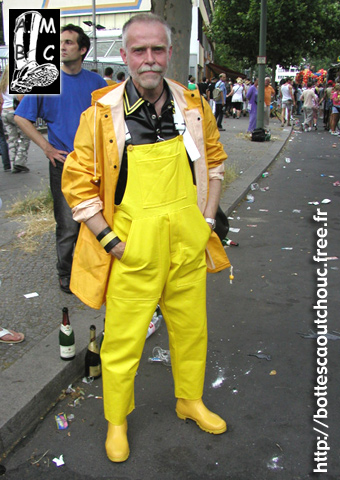 Wearing yellow raingear and yellow boots, Berlin.