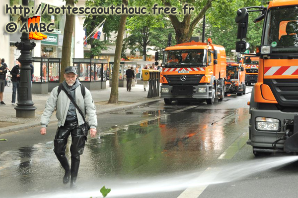 Michael is playing with the water from the lorries. 26 June 2011.