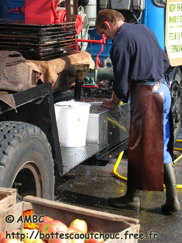Making the cider, France, 2006. Bottes caoutchouc.