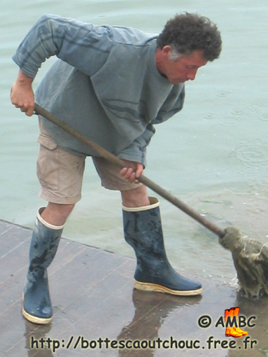Fisherman wearing shorts & rubber boots, France, 2003.
