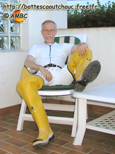 Wearing yellow rubber hip boots at the House of the Rubber Boot; Gummi waders.