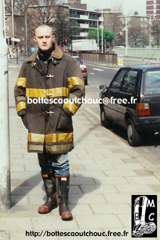 With firefighter gear, London, 1996. 