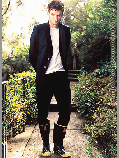 Austin Nichols wearing rain boots.