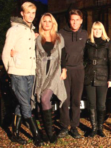 Harry Derbidge wearing black wellies, with his friends.