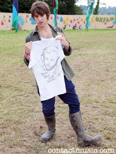 Paolo Nutini wearing rubber boots.