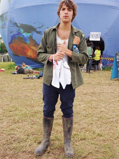 Paolo Nutini wearing muddy wellies in Glastonbury.