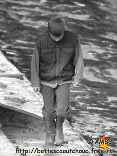 Wearing wellies into the puddles.