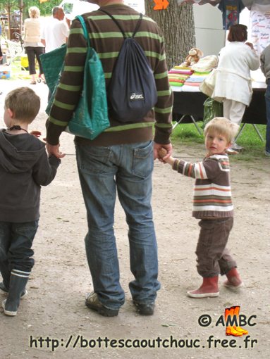 Kids in wellies and their father, 2009.