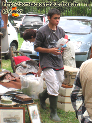 Kid in wellies; boot sales, 2009.