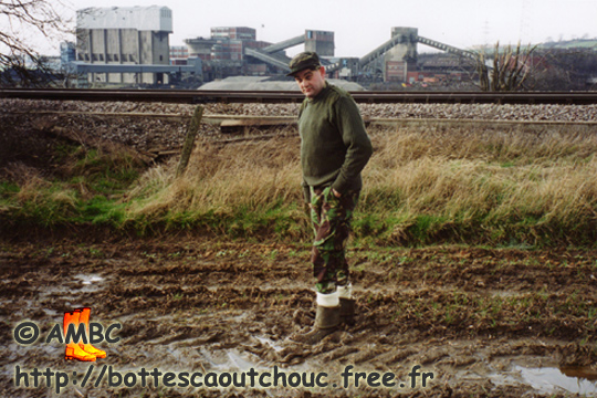Wearing turned down rubber boots in an industrail estate, 2006.