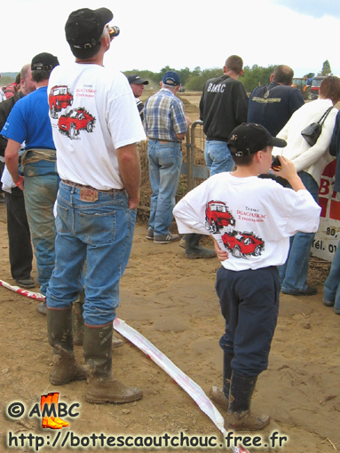 Nice looking rubberbooted participant, phoning. Gummistiefel, stivali di gomma, 2005.
