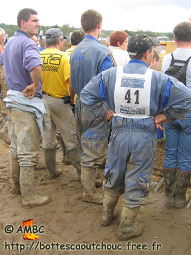 Wearing coveralls & rubber boots. Gummistiefel, stivali di gomma, 2005.