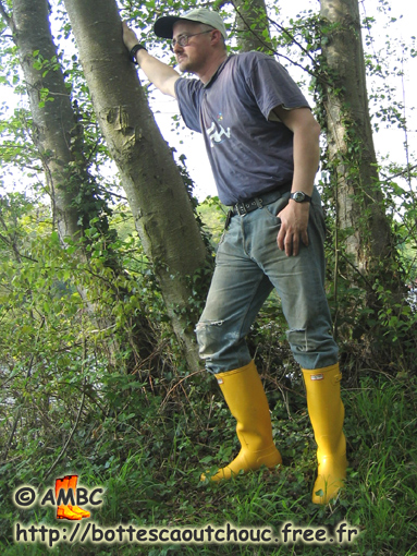 Pascal wearing yellow Hunter boots in the forest, 2007.