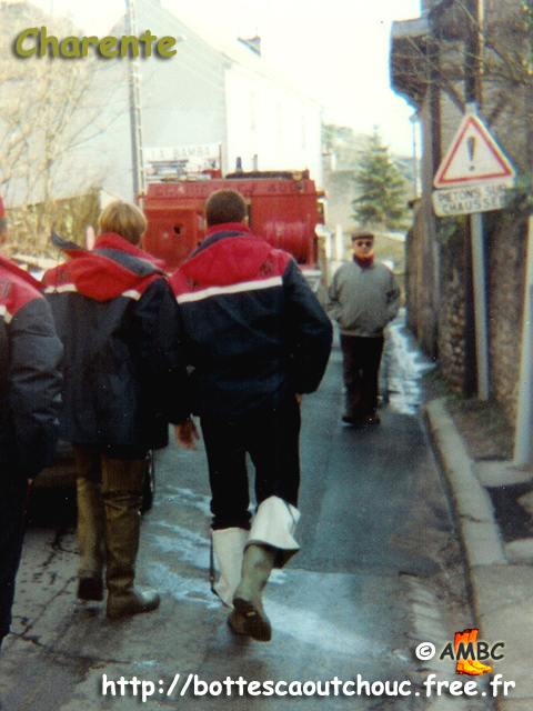 Firemen wearing waders in Charente, 1994.