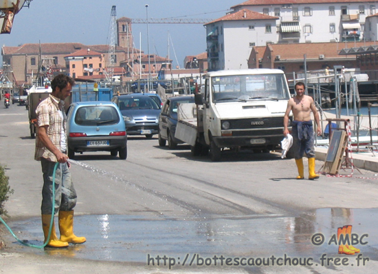 2 guys wearing yellow boots in an Italian street, 2009.