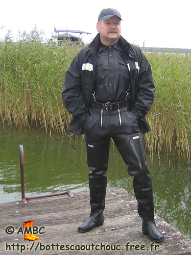 Wearing waders at the riverside; Germany, 2009.
