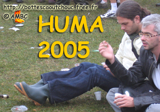 Young guy wearing PVC boots. Gummistiefel, botas de goma, bottes en caoutchouc, Sept. 2005.