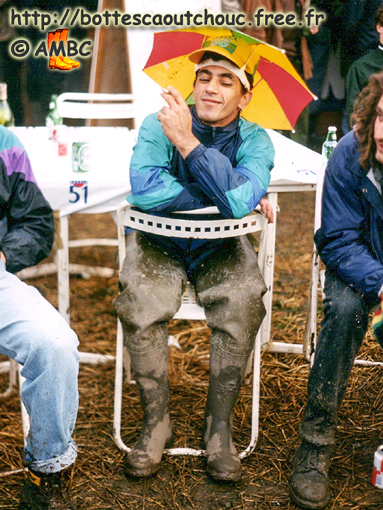 At the festival, a young guy in muddy waders, 1998.