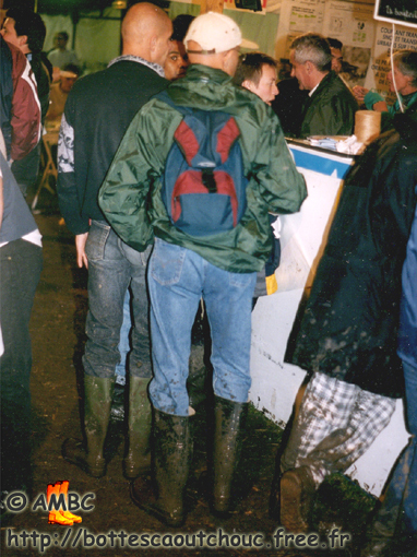 2 (gay?) guys wearing muddy boots at the festival, Sept. 1998.