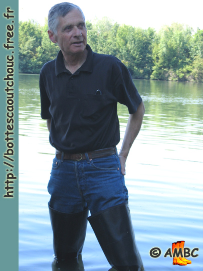 Wearing waders in the Seine river.