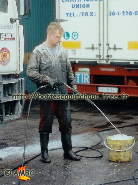 Truck washers in Budapest, Hungary, 1998. Gummistiefel, bottes caoutchouc, rubber boots.