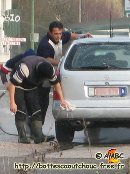 Car washers in Malmedy, Belgium, 2004. Gummistiefel, bottes caoutchouc.