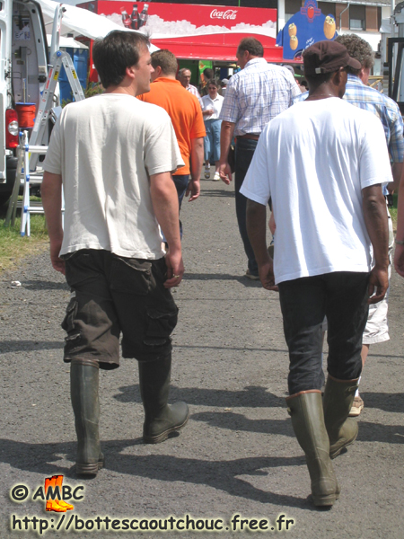 Two mates wearing Aigle wellies. Gummistiefel, botas de goma, bottes en caoutchouc, rubber laarzen, Libramont, Belgium 2008.