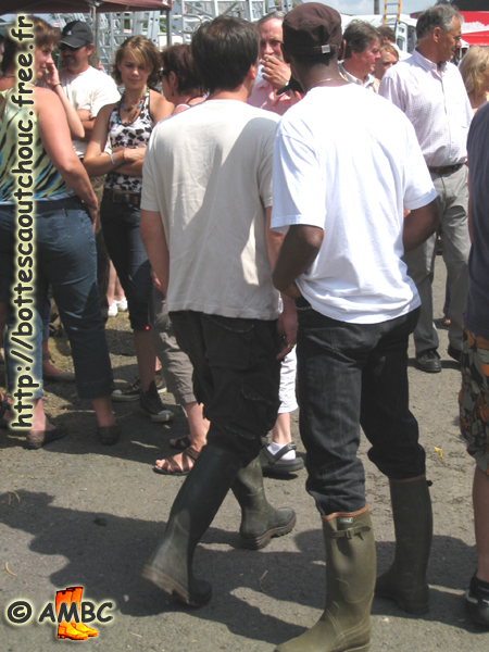 Two mates wearing Aigle wellies. Gummistiefel, botas de goma, bottes en caoutchouc, rubber laarzen, Libramont, Belgium 2008.