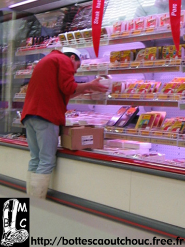 Butcher at work, France, Gummistiefel, 2004.