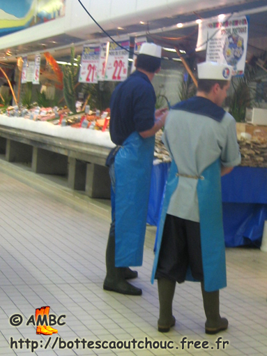 Young fishmongers in Leclerc supermarket, 2006; rubber boots, Gummistiefel.