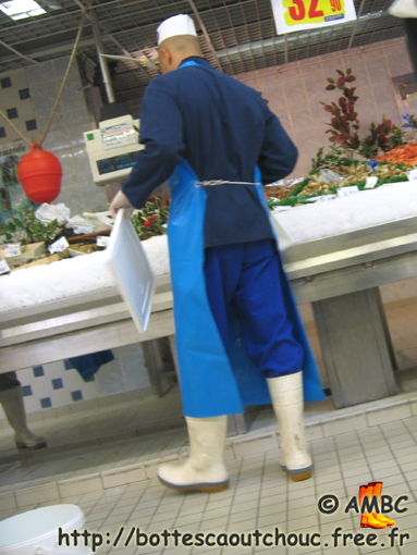 Young fishmonger in white boots, 2006; rubber boots, Gummistiefel.