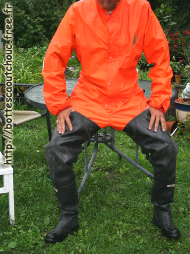 Mike wearing waders & orange PVC coveralls . Gummistiefel, bottes caoutchouc, rubber boots, Gummistövlar, 2011.