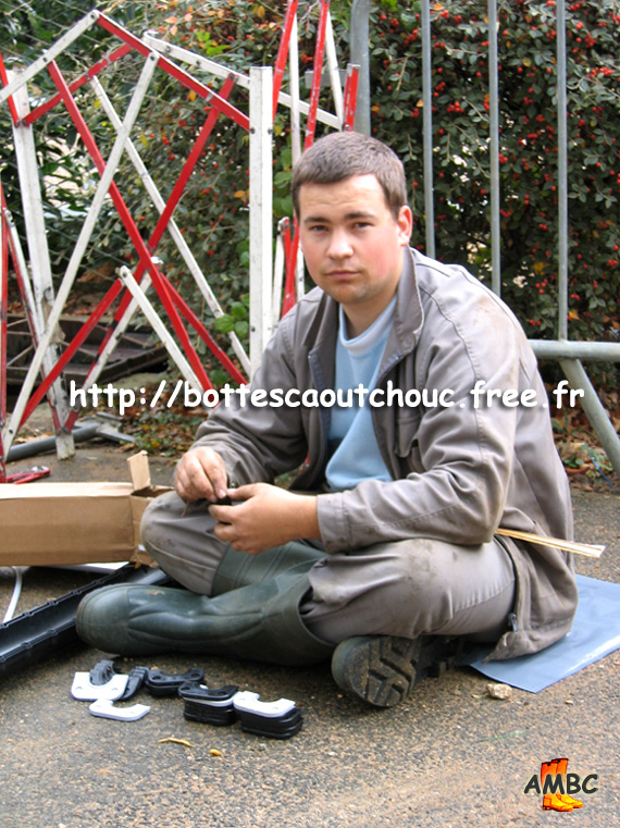 Young electrician wearing PVC boots in Dammarie Les Lys