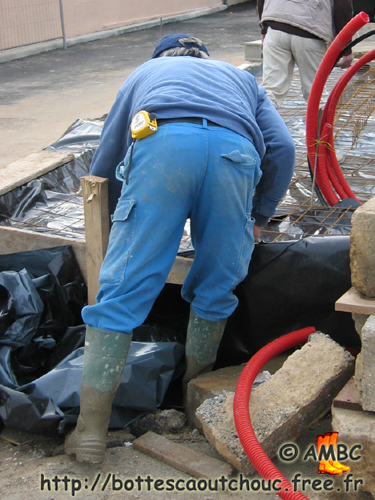 Worker wearing PVC working boots, France, 2007.