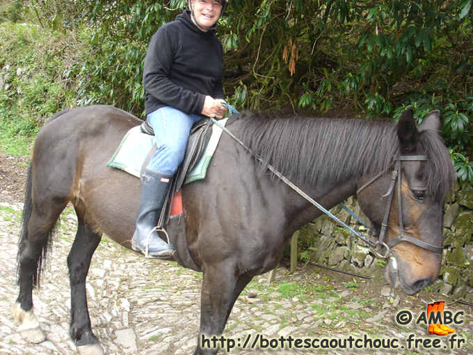 Riding a horse, wearing Hunter wellies, 2010.